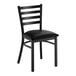 A black ladder back chair with a black vinyl padded seat and a detached seat design.