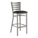 A Lancaster Table & Seating ladder back bar stool with a black vinyl padded seat on a white background.