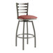 A Lancaster Table & Seating metal ladder back bar stool with a burgundy cushion.