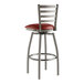 A Lancaster Table & Seating clear coat finish ladder back swivel bar stool with a burgundy vinyl padded seat.