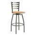 A Lancaster Table & Seating metal bar stool with a natural wood seat.