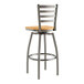 A Lancaster Table & Seating metal bar stool with a natural wood seat and ladder back.