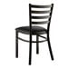 A black Lancaster Table & Seating ladder back chair with a black cushion.