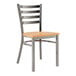 A Lancaster Table & Seating metal chair with a wooden seat and back.
