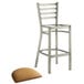 A metal Lancaster Table & Seating ladder back bar stool with a light brown cushion