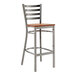 A Lancaster Table & Seating ladder back bar stool with a wooden seat.