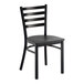 A black ladder back chair with a distressed copper finish and a solid black wood seat.