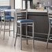 Lancaster Table & Seating ladder back bar stools with navy blue padded seats