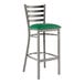 A Lancaster Table & Seating clear coat finish ladder back bar stool with a green vinyl padded seat on metal legs.