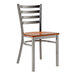 A Lancaster Table & Seating metal ladder back chair with a wood seat and back.