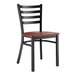 A Lancaster Table & Seating black metal ladder back chair with a mahogany wood seat.