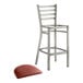 A Lancaster Table & Seating metal bar stool with a burgundy vinyl padded seat.