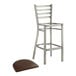 A Lancaster Table & Seating metal bar stool with a dark brown cushion seat.