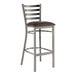 A Lancaster Table & Seating metal bar stool with a dark brown cushion on the seat.