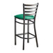 A Lancaster Table & Seating distressed copper ladder back bar stool with a green vinyl padded seat.