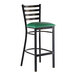 A ladder back bar stool with a distressed copper finish and a green vinyl padded seat.