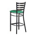 A bar stool with a distressed copper finish, ladder back design, and a green vinyl padded seat.