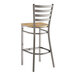 A Lancaster Table & Seating metal bar stool with a wooden seat.