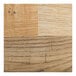 A close-up of a driftwood-finished wooden seat with a natural wood grain pattern.