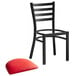 A Lancaster Table & Seating black ladder back chair with red vinyl padded seat.