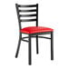 A black Lancaster Table & Seating ladder back chair with a red vinyl padded seat.