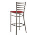 A Lancaster Table & Seating clear coat finish ladder back bar stool with a mahogany wood seat.