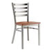 A Lancaster Table & Seating metal ladder back chair with a wood seat.