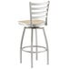 A Lancaster Table & Seating metal bar stool with a driftwood seat.