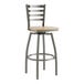 A Lancaster Table & Seating metal ladder back bar stool with a driftwood seat.