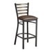 A Lancaster Table & Seating distressed copper finish metal bar stool with dark brown vinyl padded seat.