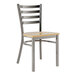 A Lancaster Table & Seating metal ladder back chair with a driftwood seat.