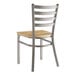 A Lancaster Table & Seating metal ladder back chair with a driftwood seat.