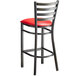 a chair with a red cushion