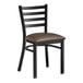 A Lancaster Table & Seating black ladder back chair with dark brown vinyl padded seat.