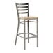 A Lancaster Table & Seating Ladder Back Bar Stool with a wooden seat.