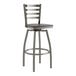 A Lancaster Table & Seating metal bar stool with a black wood seat.
