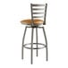 A Lancaster Table & Seating metal bar stool with a light brown cushion.