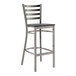 A Lancaster Table & Seating metal bar stool with a black wood seat.