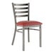 A Lancaster Table & Seating metal ladder back chair with burgundy vinyl padded seat