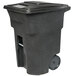 A black Toter rectangular trash can with wheels.