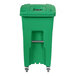 a green recycle bin with a metal handle