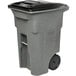 A gray Toter rectangular trash can with wheels and a black lid.