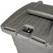 A Toter gray rectangular wheeled trash can with a lockable lid.