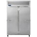 A large silver Traulsen G Series reach-in refrigerator with two doors, one white and one stainless steel.