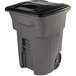 A grey Toter rectangular trash can with a black lid.