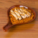 A CAC Festiware brown fry pan plate with rice and chicken.