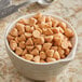 A bowl of Guittard Butterscotch 1M chips on a counter.