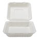 A white bagasse take-out container with a rectangular section in the middle.