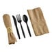 A Fineline Conserveware pre-rolled black napkin and black CPLA flatware kit with a knife and spoon.
