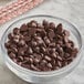 A bowl of Guittard semi-sweet chocolate chips on a counter.